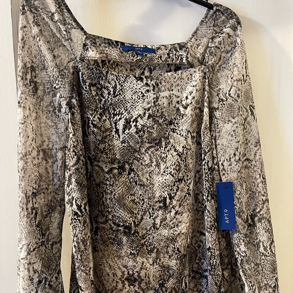 Snake skin polyester woman’s blouse.